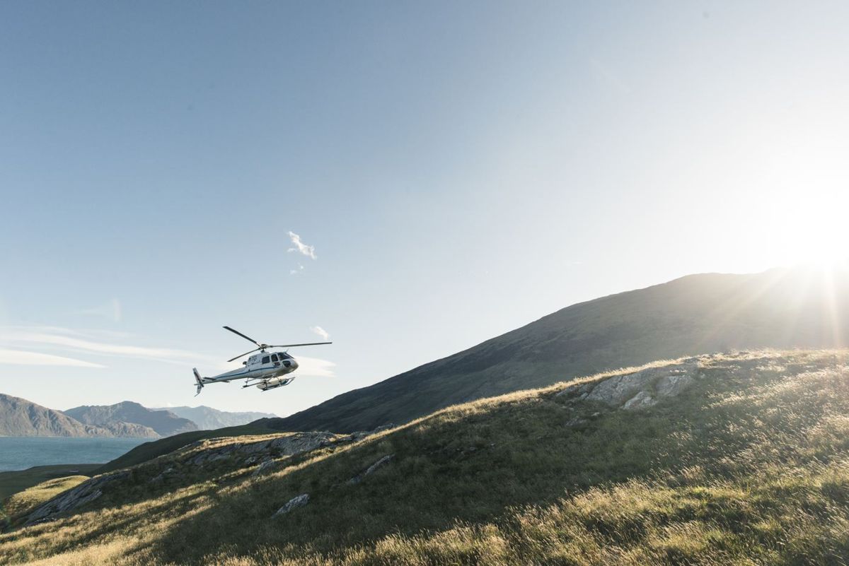 A helicopter over the high country at Minaret Station
